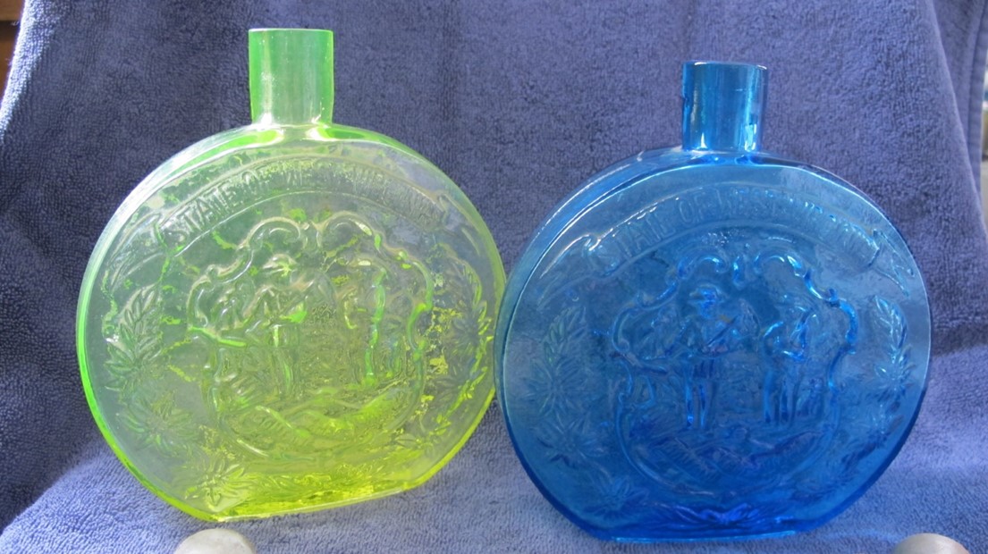 West Virginia Decorative Decanter (Imperial) blue and green on a blue background.